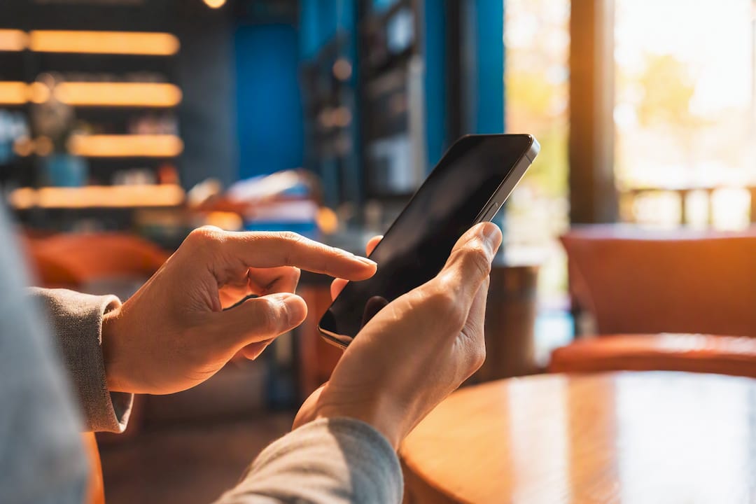 Hands enabling preview mode on smartphone
