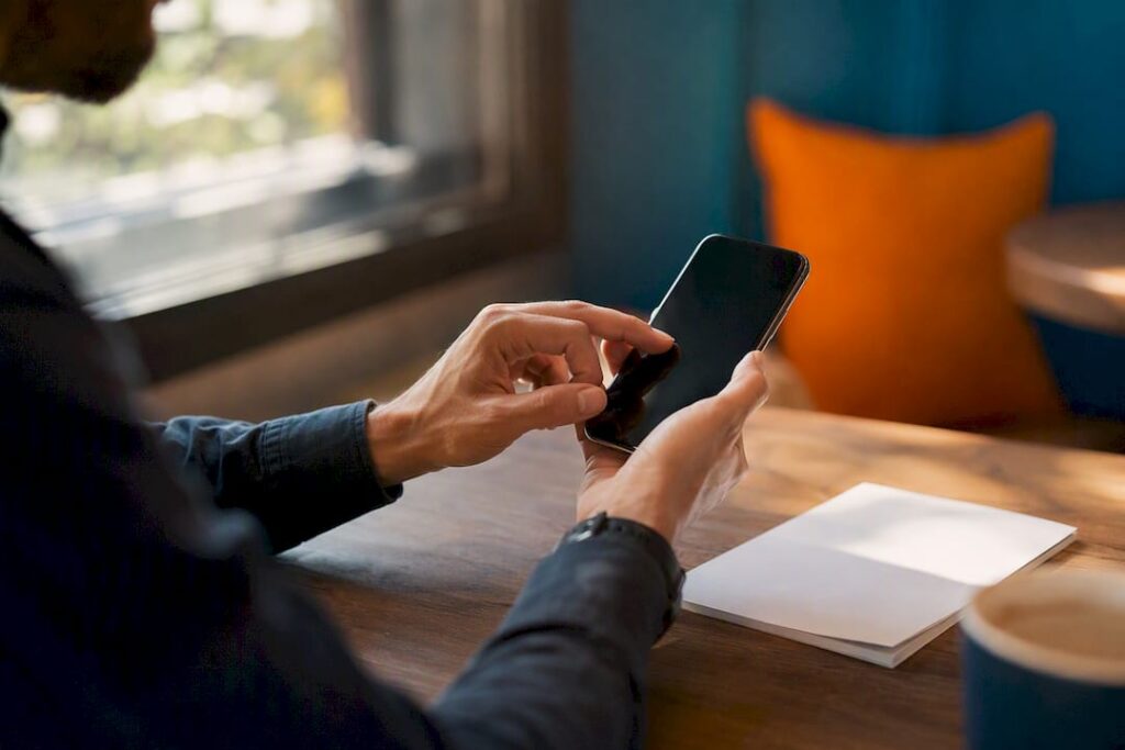 Hands assembling Google review link on phone