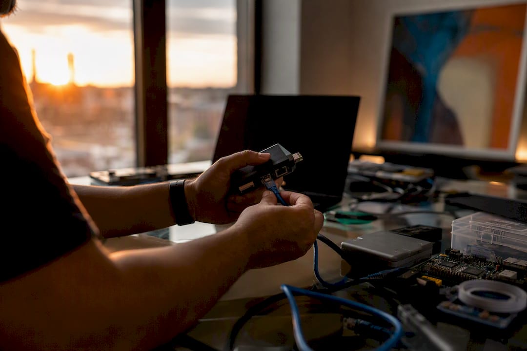 Hands performing hardware test in staging environment